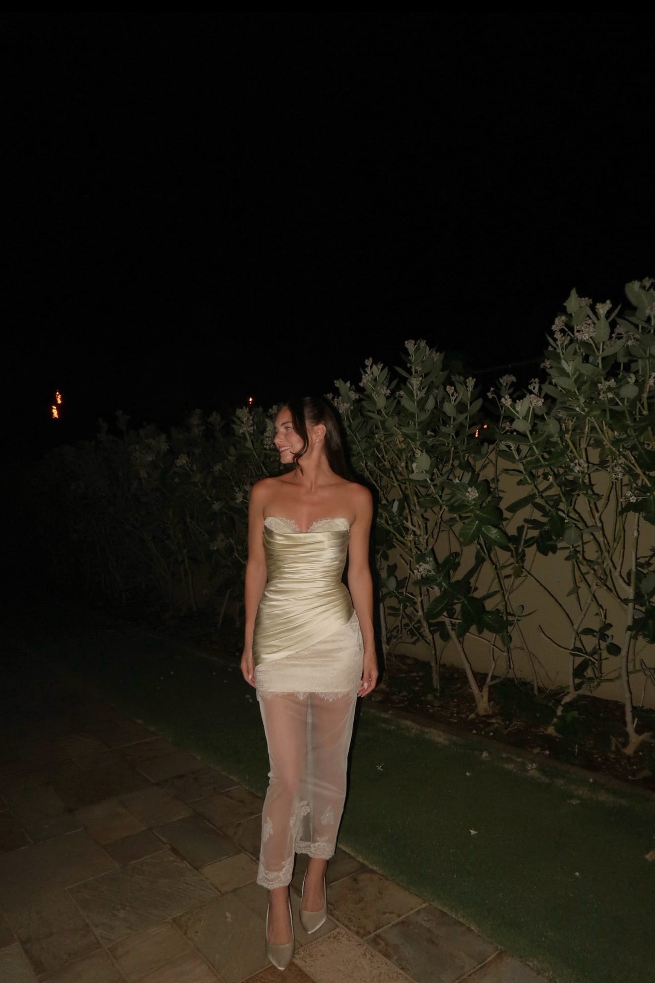 Custom champagne silk strapless wedding dress with lace hem and sheer overlay — real client photo by Jinza Bridal