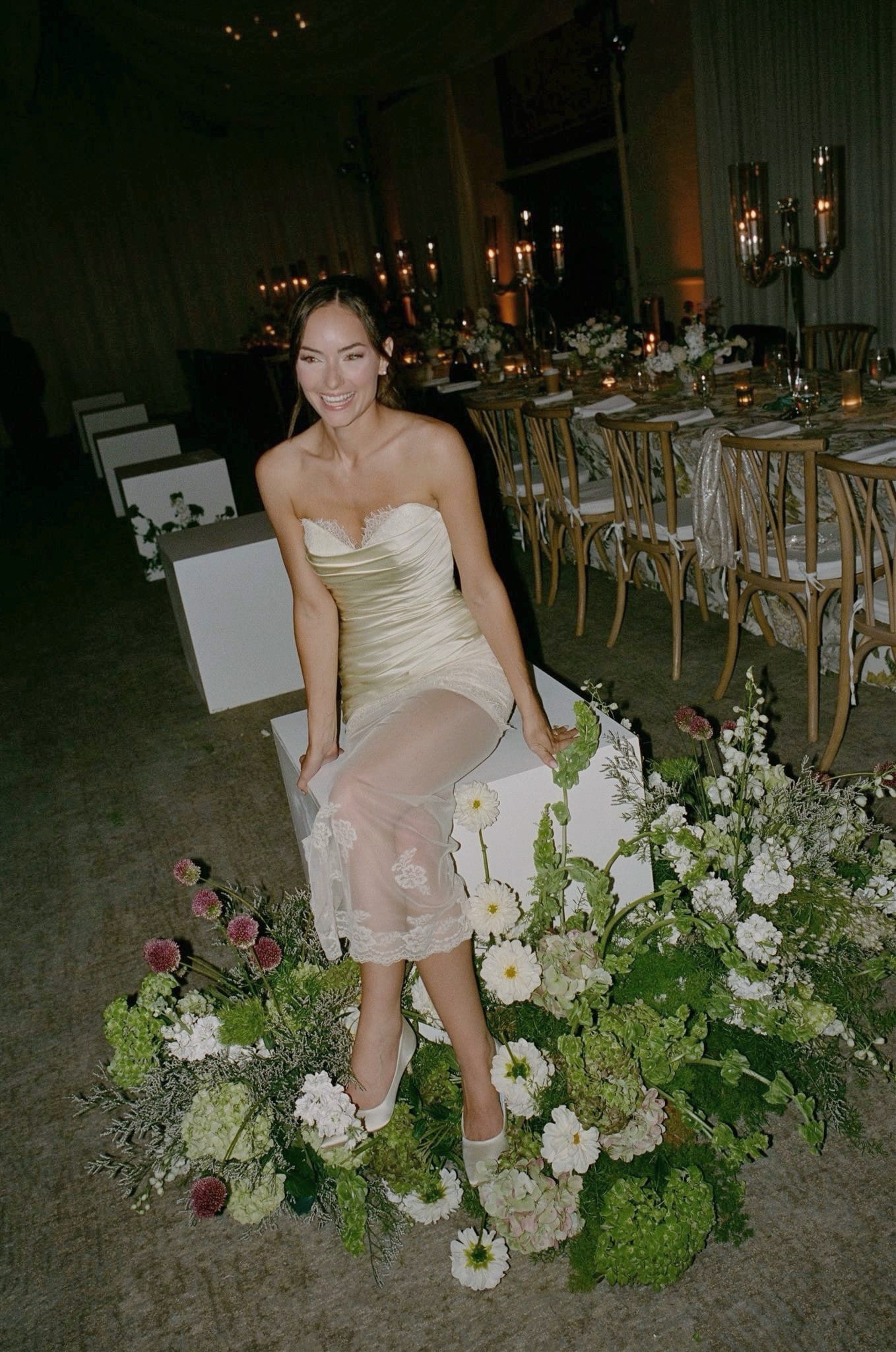 Real client wearing a custom champagne silk strapless wedding dress with sheer lace overlay at her wedding reception — Jinza Bridal Los Angeles